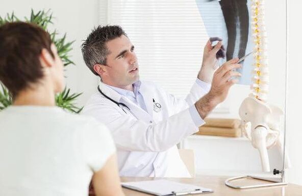 A doctor consult a patient with cervical spinal osteochondrosis