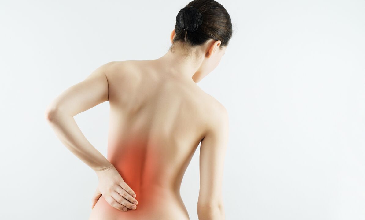 A woman is worried about back pain in the lumbar region