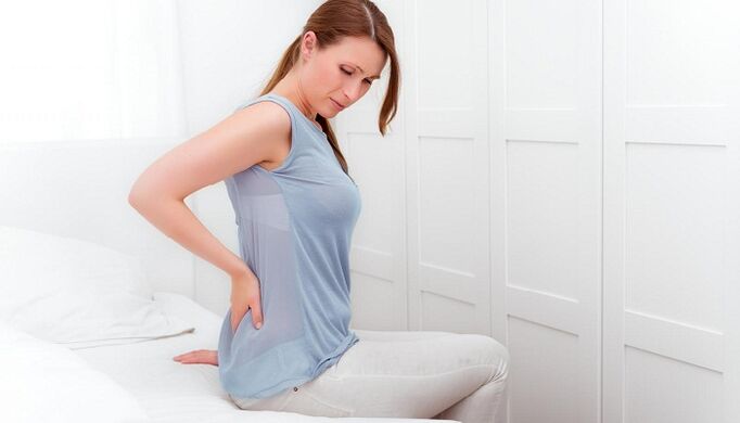 A woman is worried about back pain